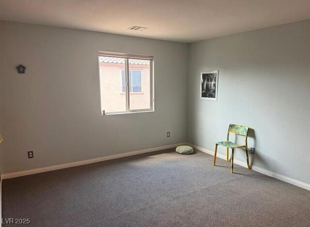 spare room featuring carpet floors