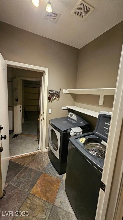 laundry room featuring washer and dryer