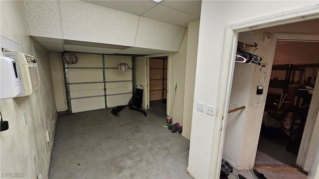 garage with a wall mounted air conditioner