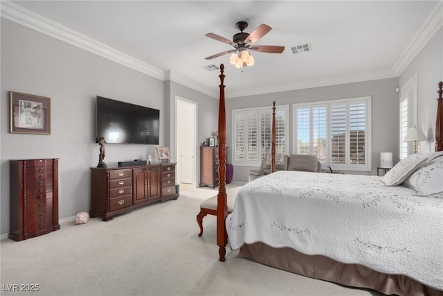 carpeted bedroom featuring ceiling fan and crown molding