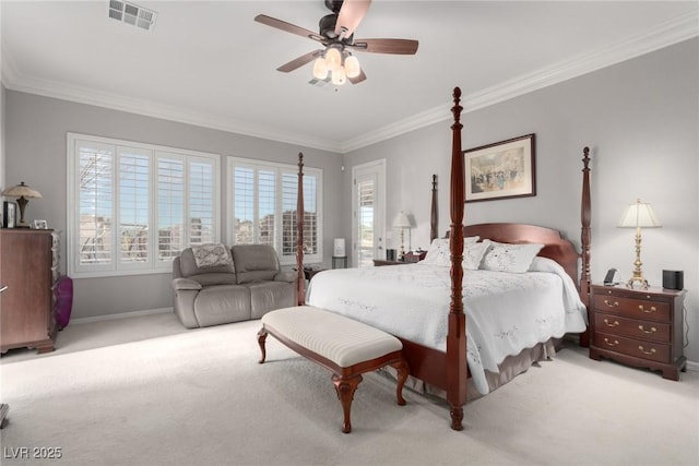 bedroom featuring ceiling fan, light colored carpet, and ornamental molding