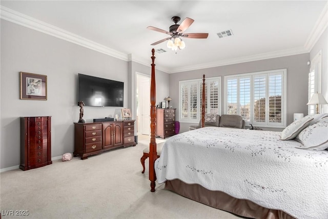 carpeted bedroom with ceiling fan and crown molding