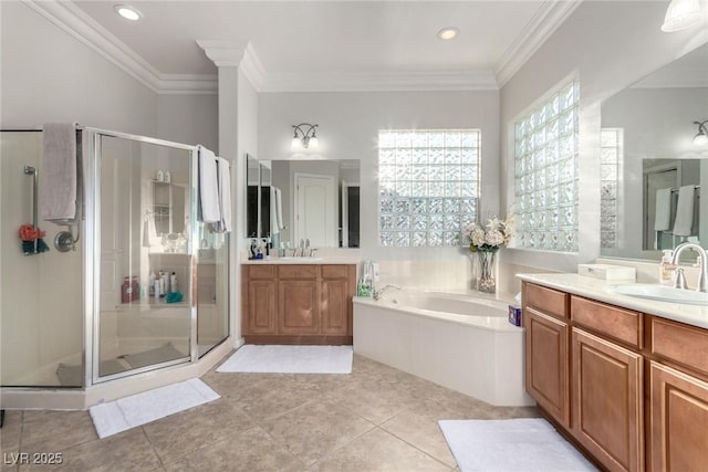 bathroom with shower with separate bathtub, vanity, and tile patterned floors