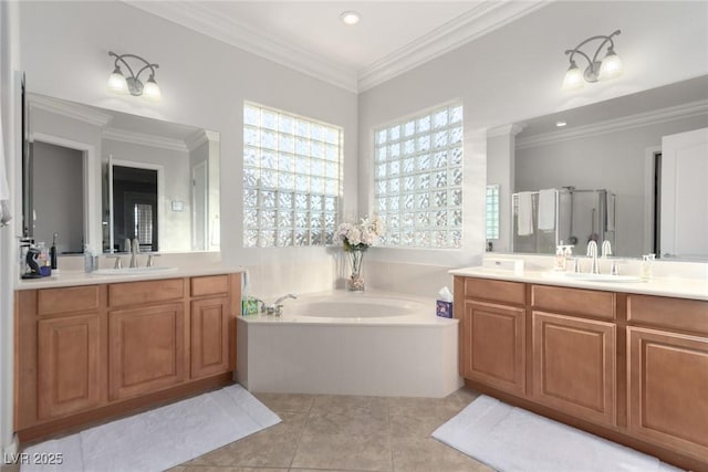 bathroom featuring tile patterned floors, crown molding, vanity, and independent shower and bath