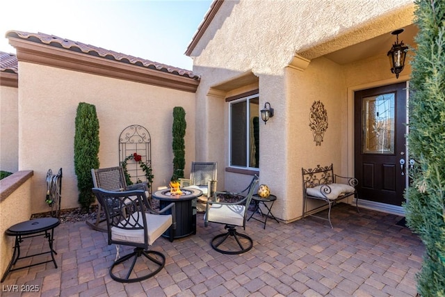 view of patio / terrace with a fire pit