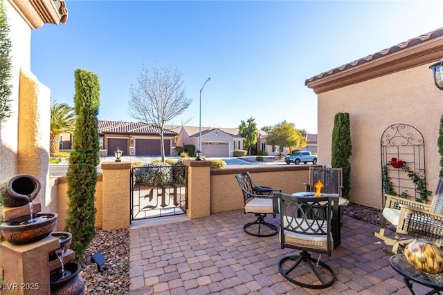 view of patio / terrace featuring a garage