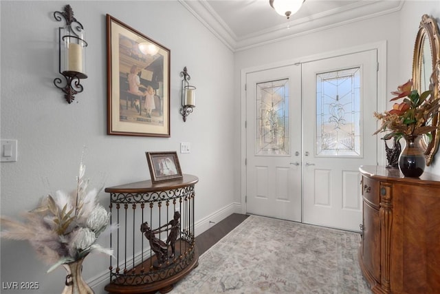 foyer entrance featuring french doors and ornamental molding