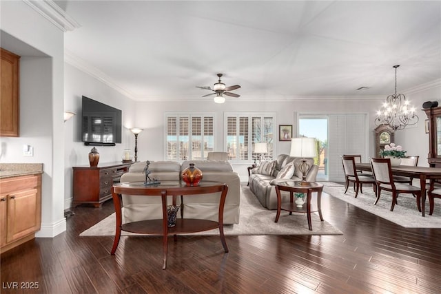 living room with ceiling fan with notable chandelier, dark hardwood / wood-style floors, and ornamental molding