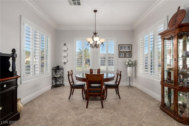 dining area with crown molding, light tile patterned flooring, and a notable chandelier