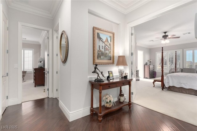 carpeted bedroom with ceiling fan and crown molding