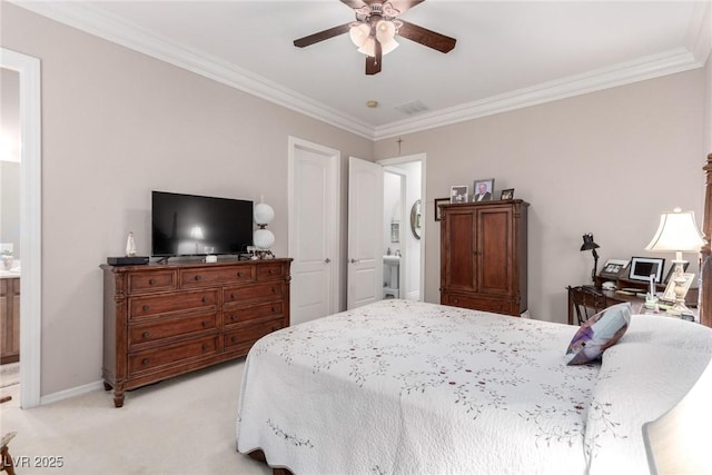 carpeted bedroom with ceiling fan, crown molding, and ensuite bath