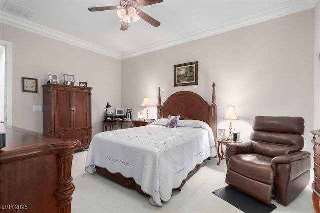 carpeted bedroom with ceiling fan and ornamental molding