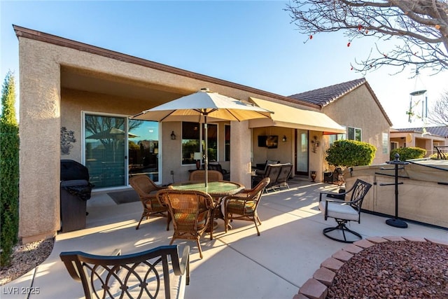 back of property featuring a patio