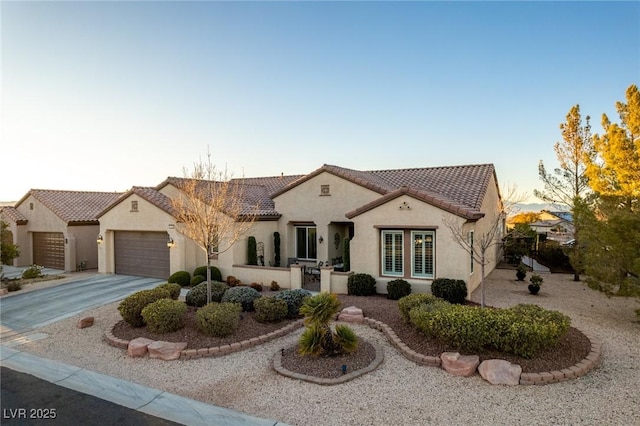 mediterranean / spanish-style home featuring a garage