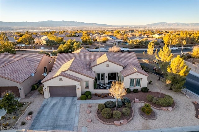 drone / aerial view featuring a mountain view