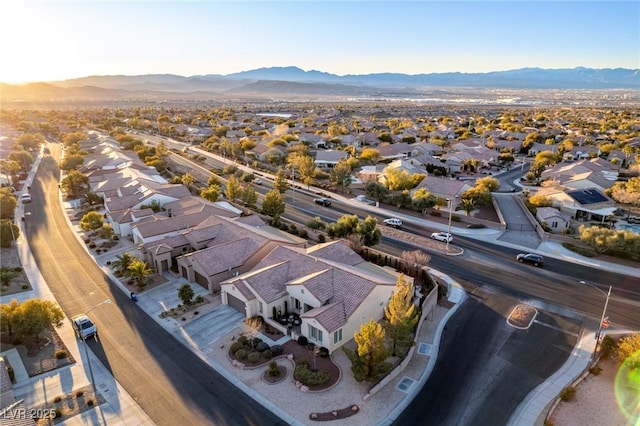 birds eye view of property with a mountain view