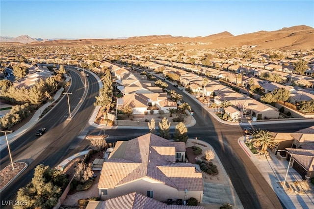 birds eye view of property featuring a mountain view