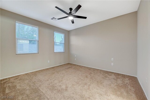 carpeted empty room with ceiling fan