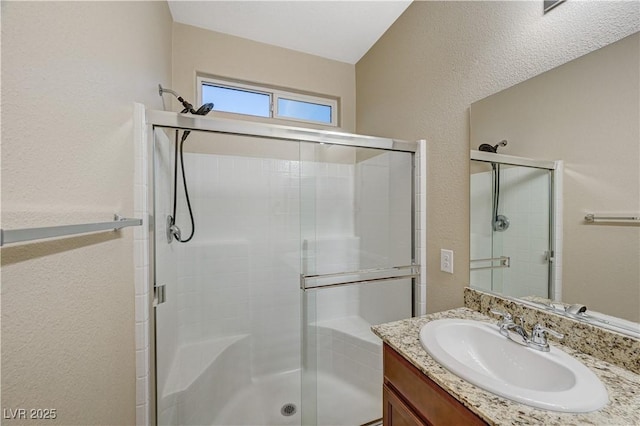 bathroom with vanity and walk in shower