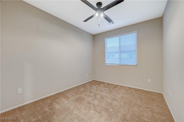 empty room featuring light carpet and ceiling fan