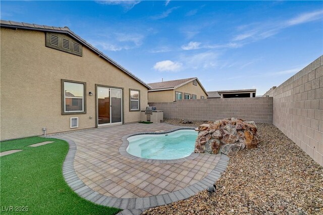 view of pool featuring a patio area