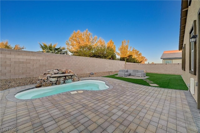 view of pool with a patio area and an outdoor hangout area