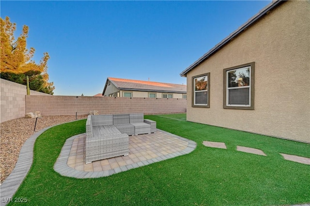 view of yard featuring an outdoor living space and a patio area