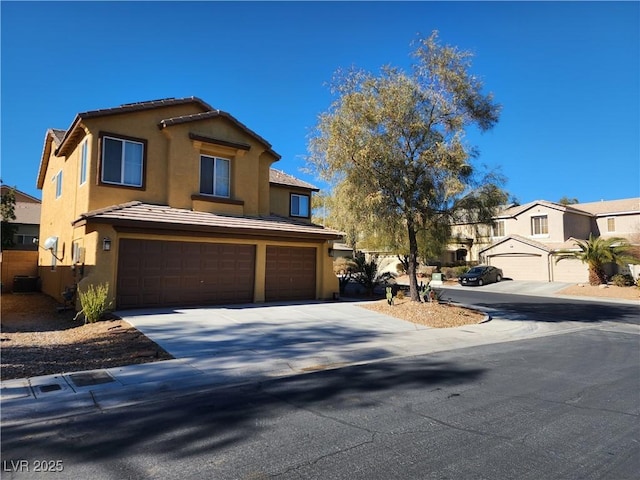 view of front of home featuring central AC unit and a garage