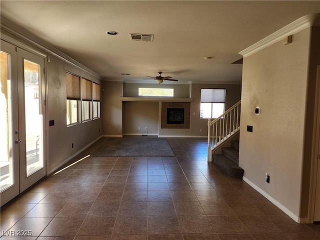 entrance foyer with french doors, ceiling fan, and crown molding