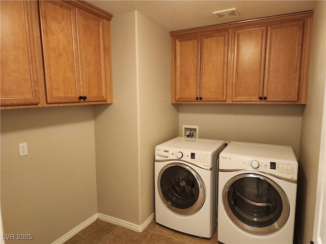 washroom with cabinets, tile patterned flooring, and independent washer and dryer