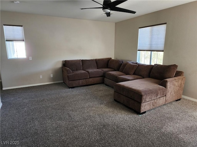 carpeted living room featuring ceiling fan and plenty of natural light