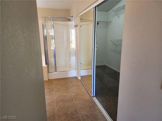 bathroom with a shower with shower door