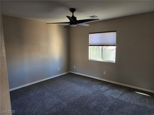 unfurnished room featuring ceiling fan and carpet