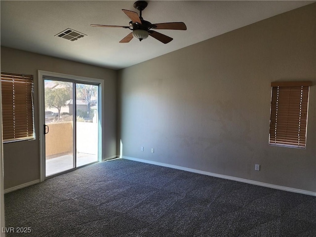 carpeted spare room with ceiling fan