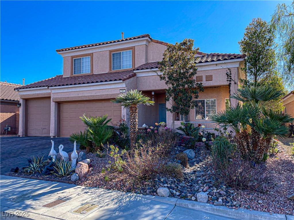 mediterranean / spanish-style home featuring a garage