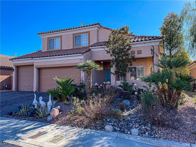 mediterranean / spanish-style home featuring a garage