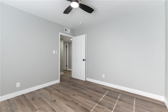 unfurnished bedroom with ceiling fan and hardwood / wood-style floors