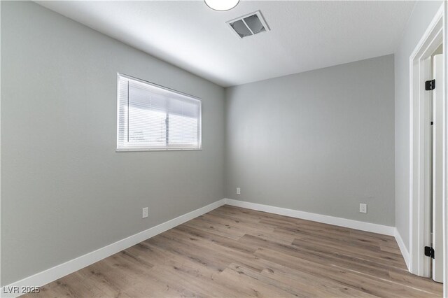 unfurnished room featuring light hardwood / wood-style flooring