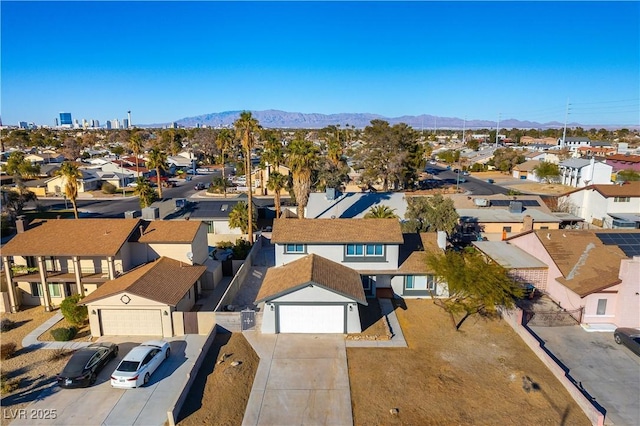 birds eye view of property featuring a mountain view