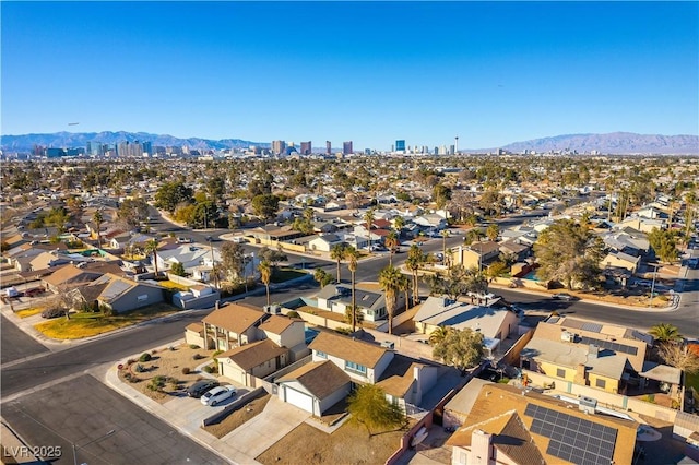 birds eye view of property featuring a mountain view