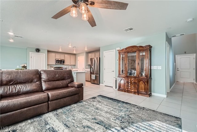 tiled living room with ceiling fan