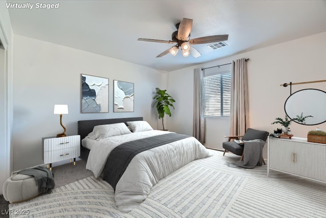 carpeted bedroom with ceiling fan