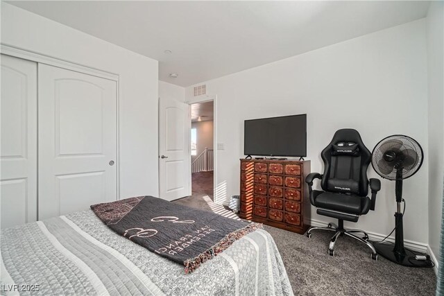 carpeted bedroom featuring a closet