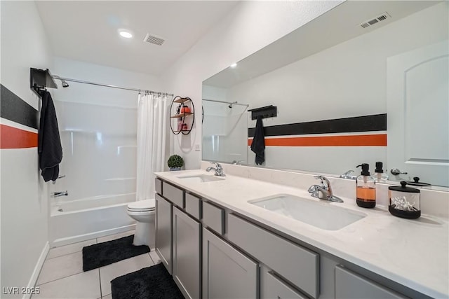 full bathroom with tile patterned floors, toilet, shower / bath combo, and vanity