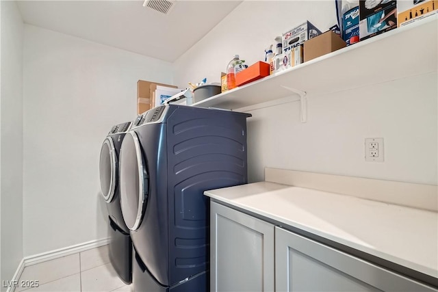 washroom featuring light tile patterned floors and independent washer and dryer