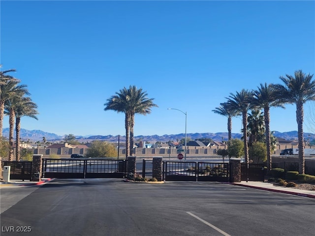 view of gate with a mountain view