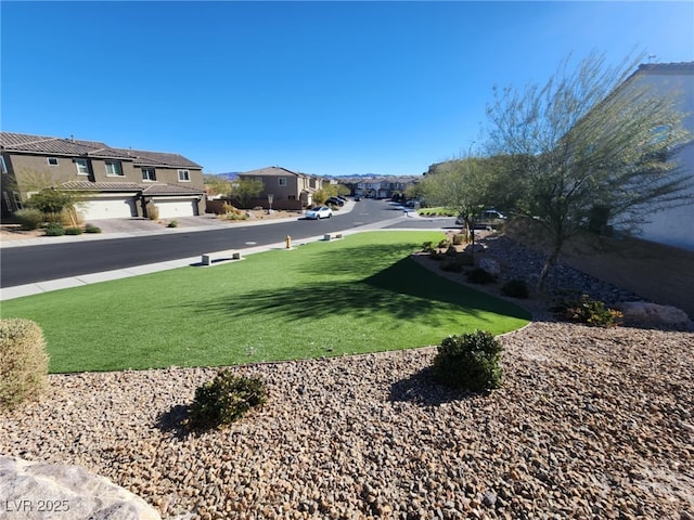 view of yard featuring a garage