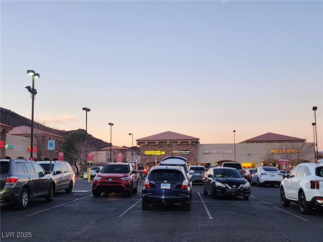 view of parking at dusk