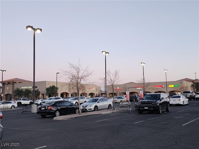 view of parking at dusk