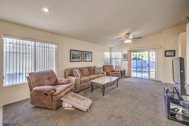 living room featuring carpet flooring, ceiling fan, and lofted ceiling